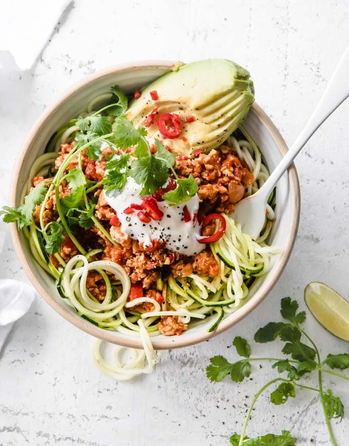low carb chili served in a bowl with zucchini noodles and a fork