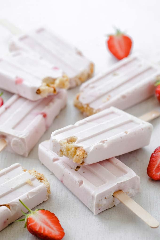 sugar free popsicles on top of each other with halved strawberries