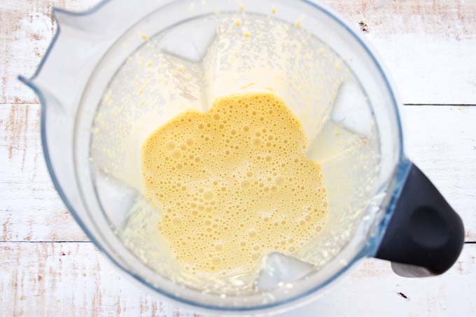 Frothy batter in a blender.