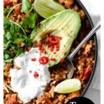 keto chili in a pan with topping