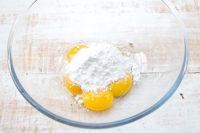 egg whites and powdered sweetener in a glass bowl