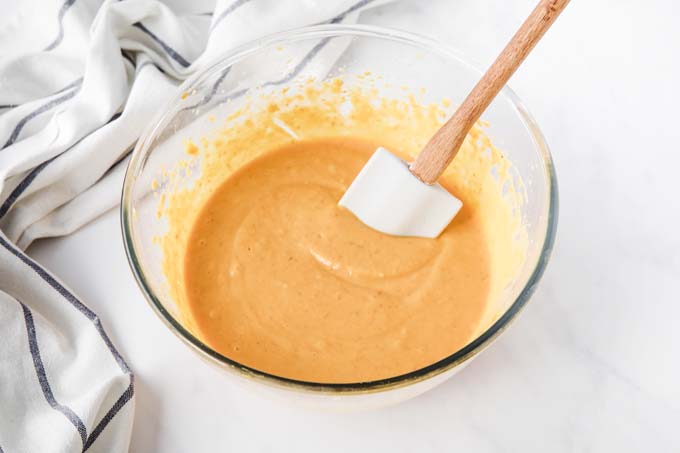 wet ingredients for pumpkin bars in a glass bowl