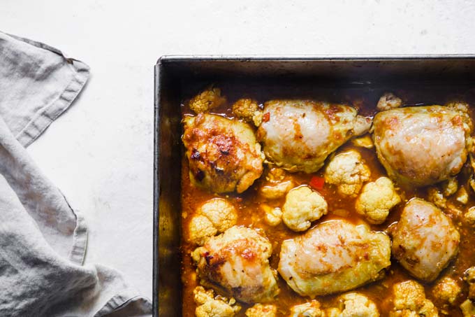 chicken thighs in a curry sauce with cauliflower