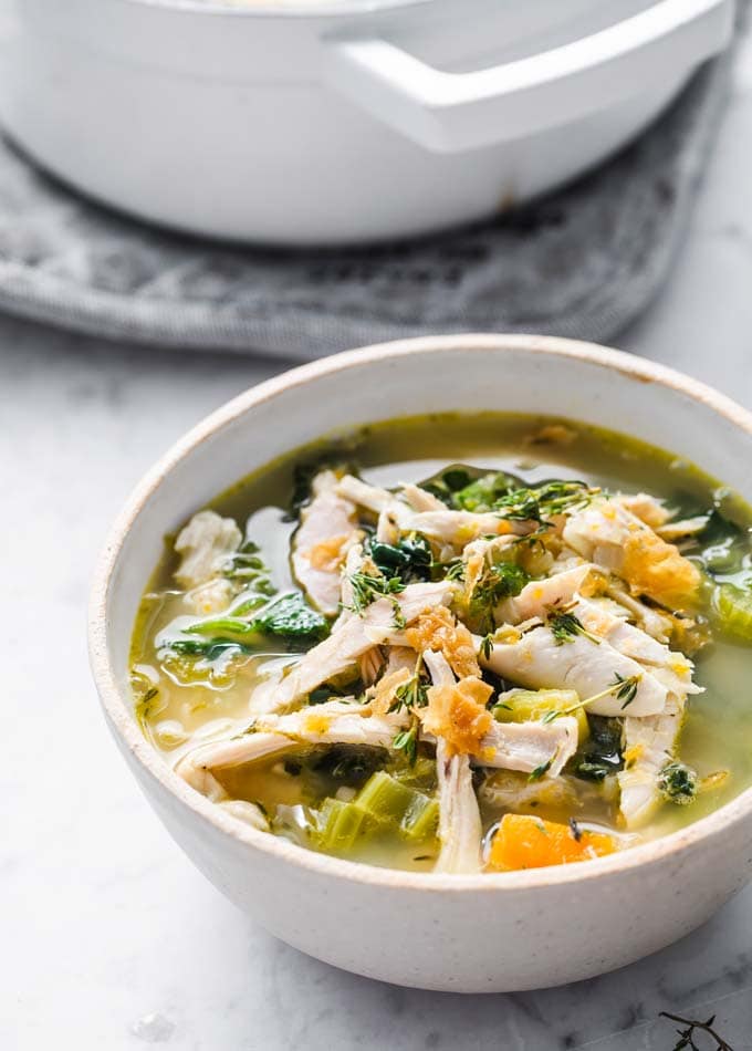 a bowl of low carb chicken soup and a pot
