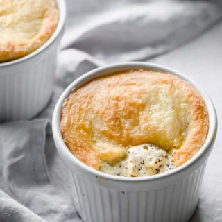 a low carb chicken pot pie in a white ramekin topped with a fathead dough crust