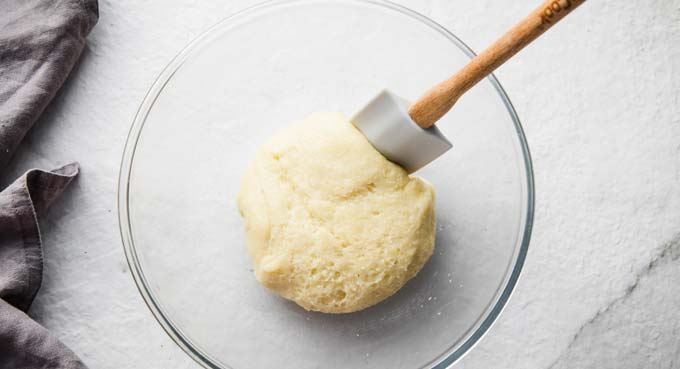 A ball of fathead dough in a glass bowl.