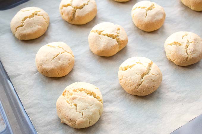 Baked biscuits on a baking sheet.