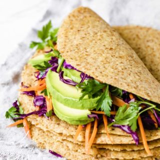 low carb tortilla filled with avocado and other fresh vegetables