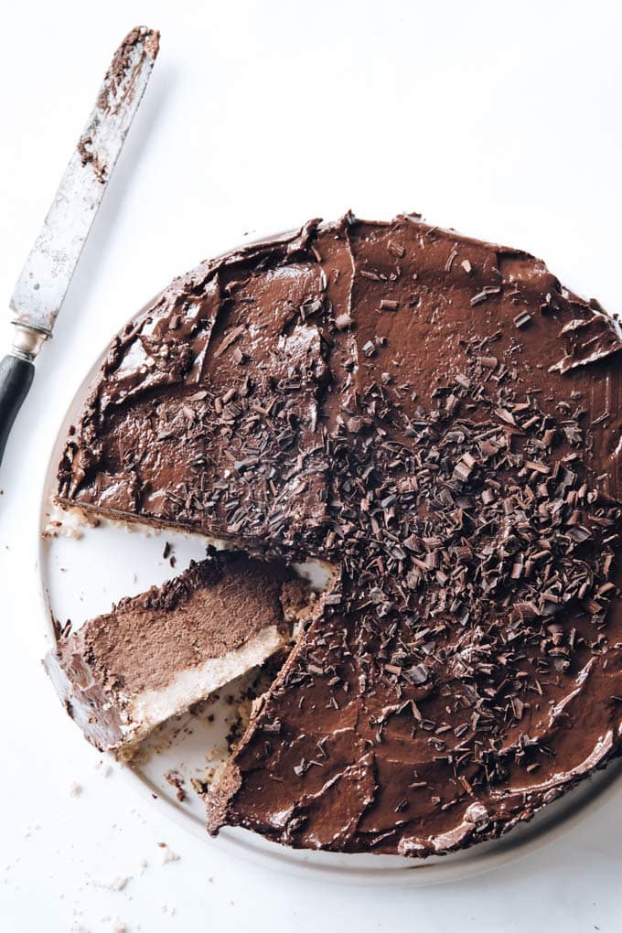 A keto chocolate cheesecake on a serving platter