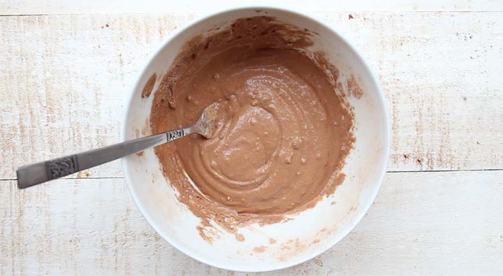 chocolate dough in a bowl with a fork