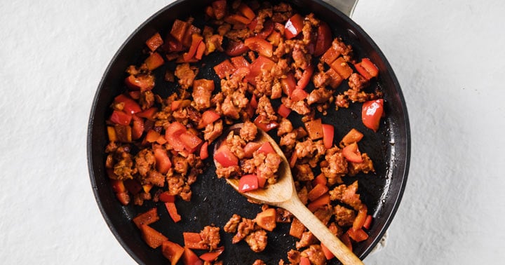 chorizo and red pepper in a frying pan