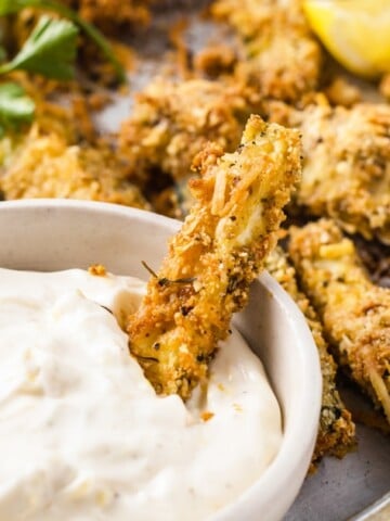 baked coated zucchini fries and a dip