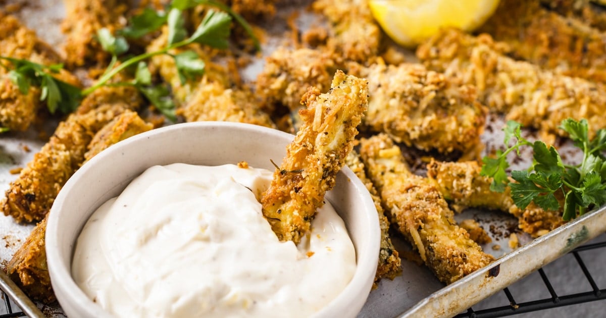 baked coated zucchini fries and a dip