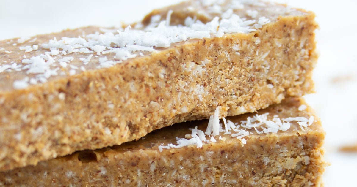 coconut almond butter bars stacked on top of each other