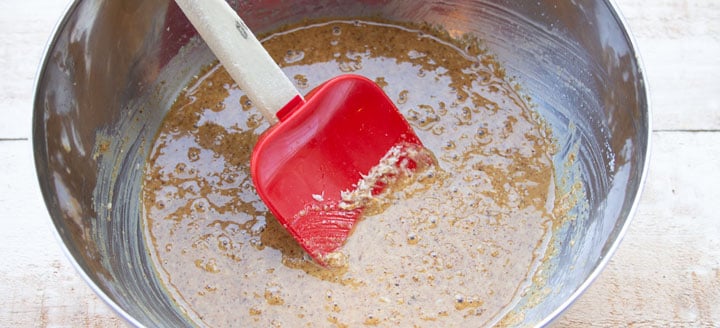 a bowl with almond butter and coconut mix and a spatula