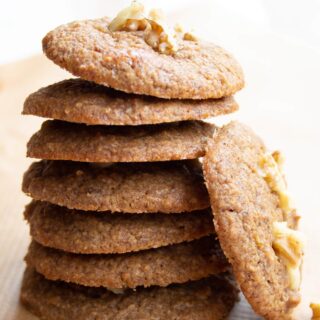 a stack of healthy banana cookies and one cookie leaning against the stack