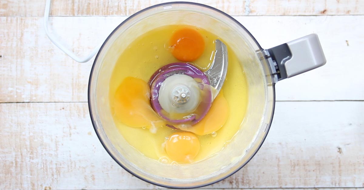 4 eggs in a food processor bowl