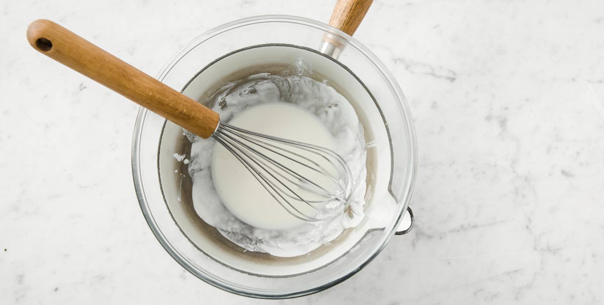 coconut butter glaze in a water bath with a balloon whisk