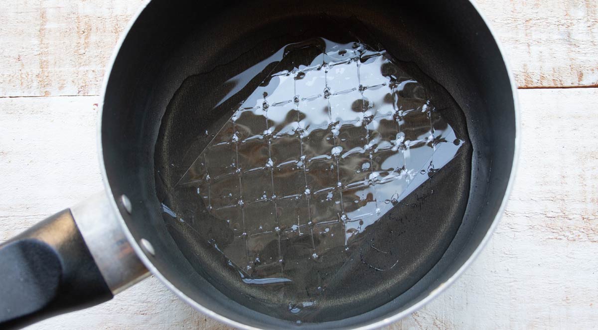 leaf gelatin with water in a saucepan