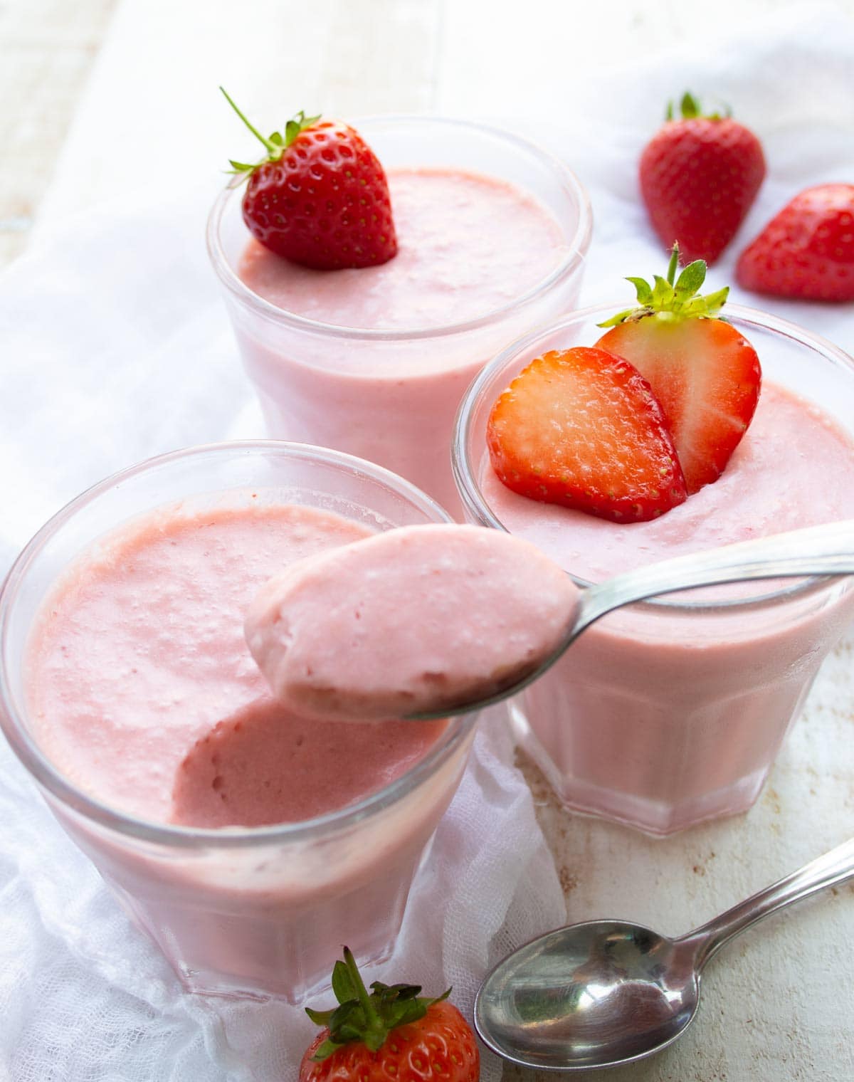 keto strawberry mousse pots and a spoon