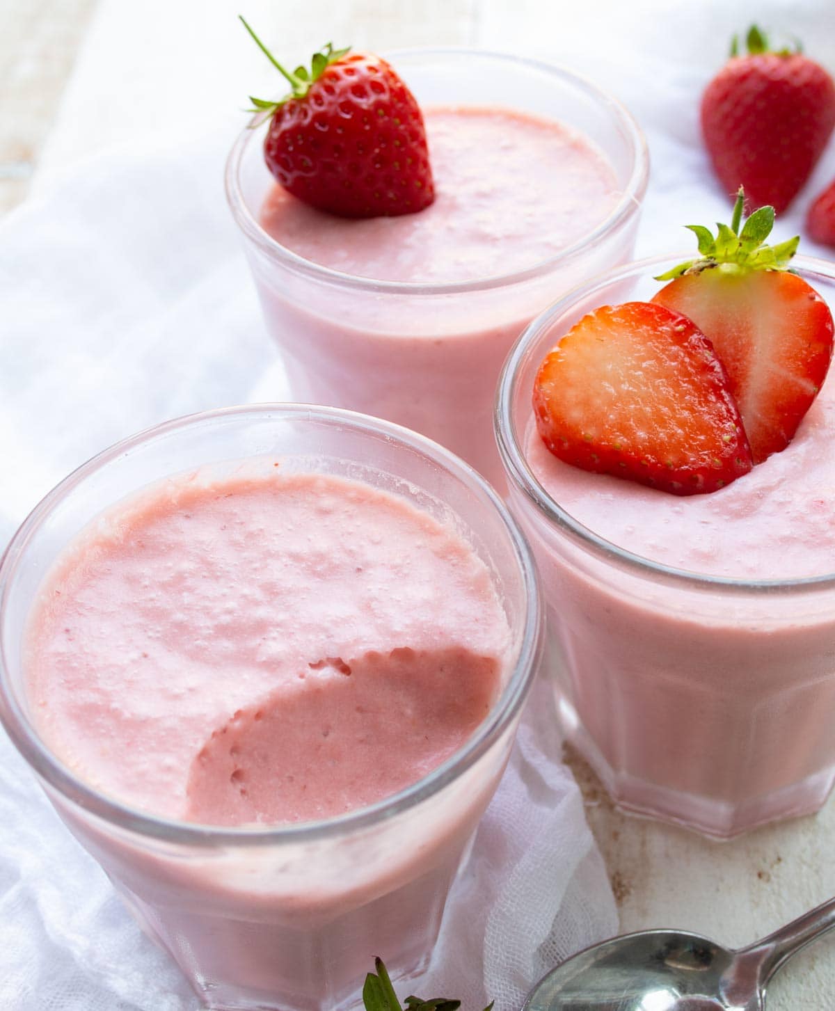 keto strawberry mousse in glasses decorated with srawberries