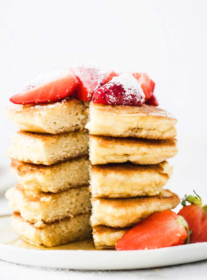 a stack of pancakes with a wedge cut out