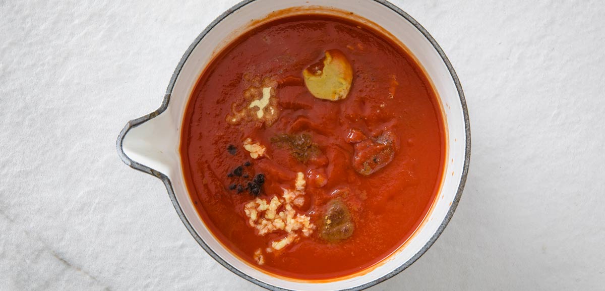 tomato puree and spices in a pot