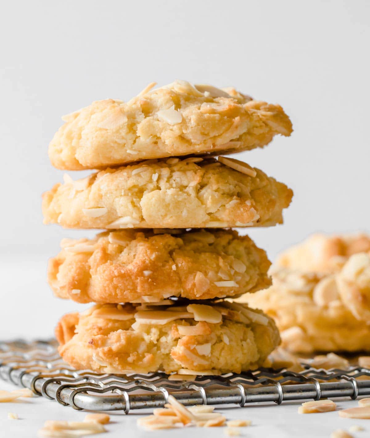 A stack of keto oatmeal cookies on a metal cooling rack.