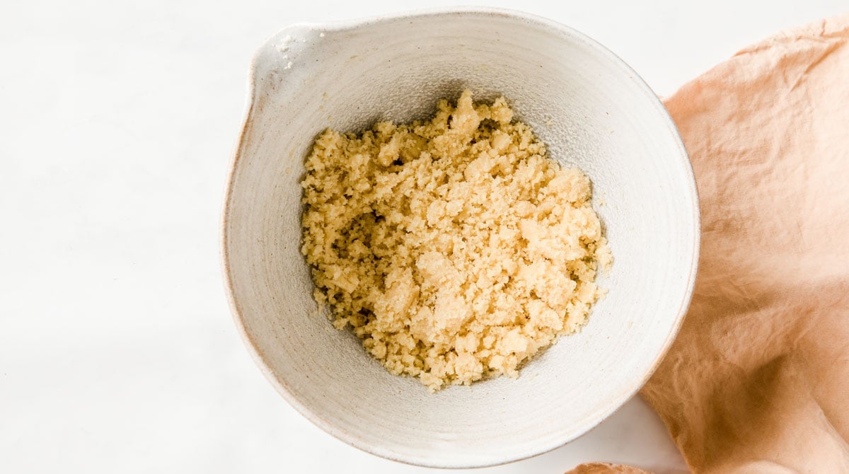 crumbly almond flour dough in a bowl