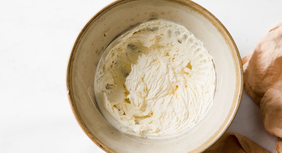 whipped cream cheese with lemon juice and powdered erythritol in a bowl