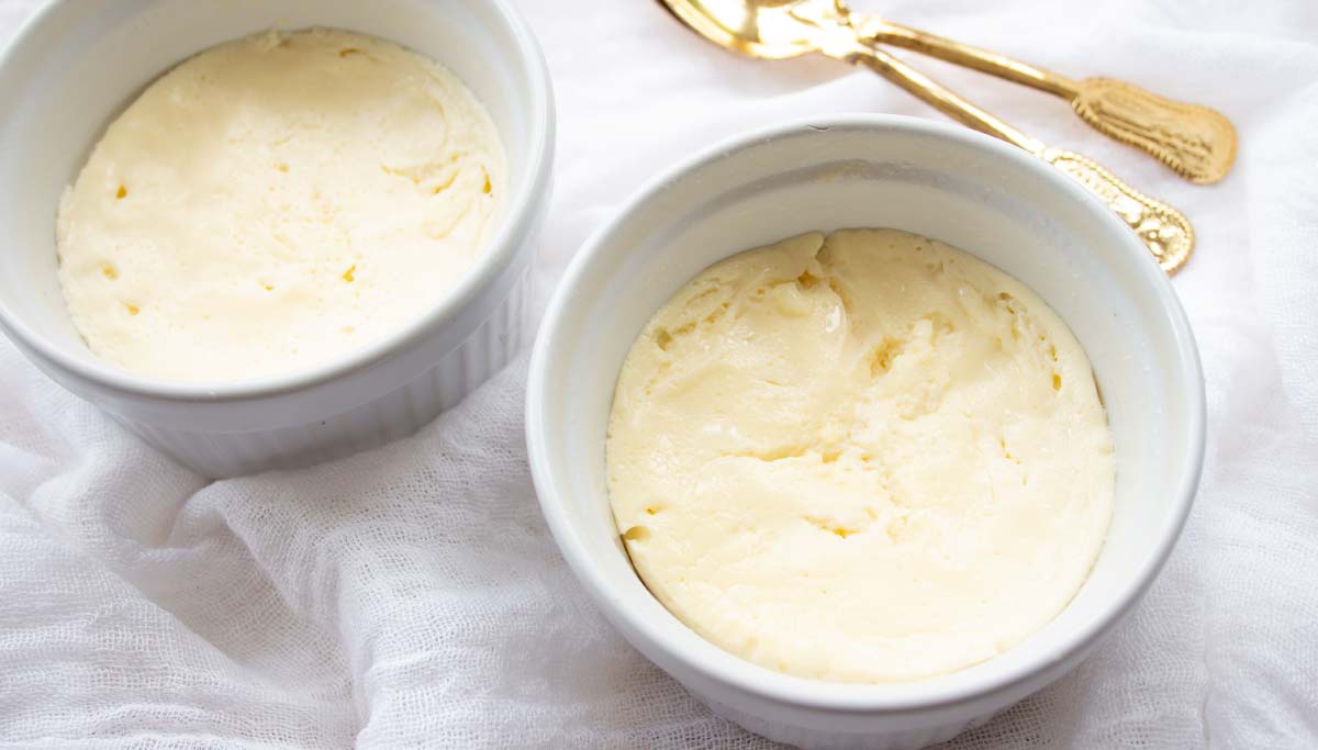 two cooked mug cheesecakes in their ramekins