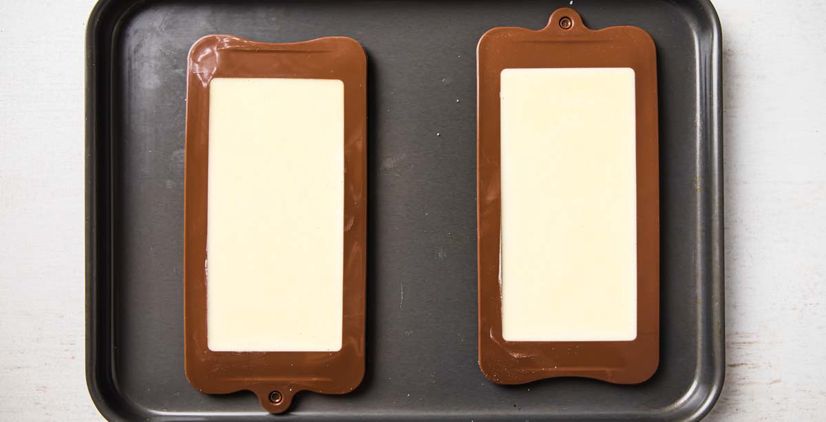 melted white chocolate in silicone moulds