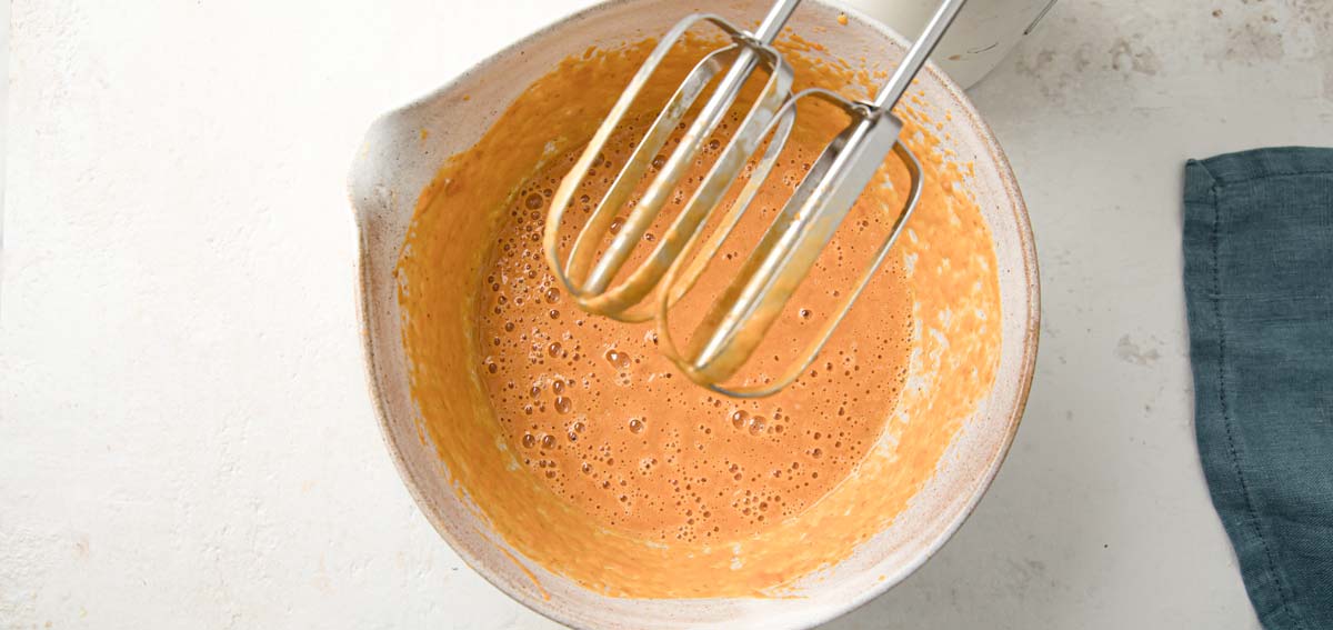 Whipped eggs and pumpkin puree.