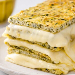 a stack of keto grilled cheese made with zucchini "bread"