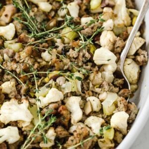 cauliflower stuffing in a serving bowl with a spoon