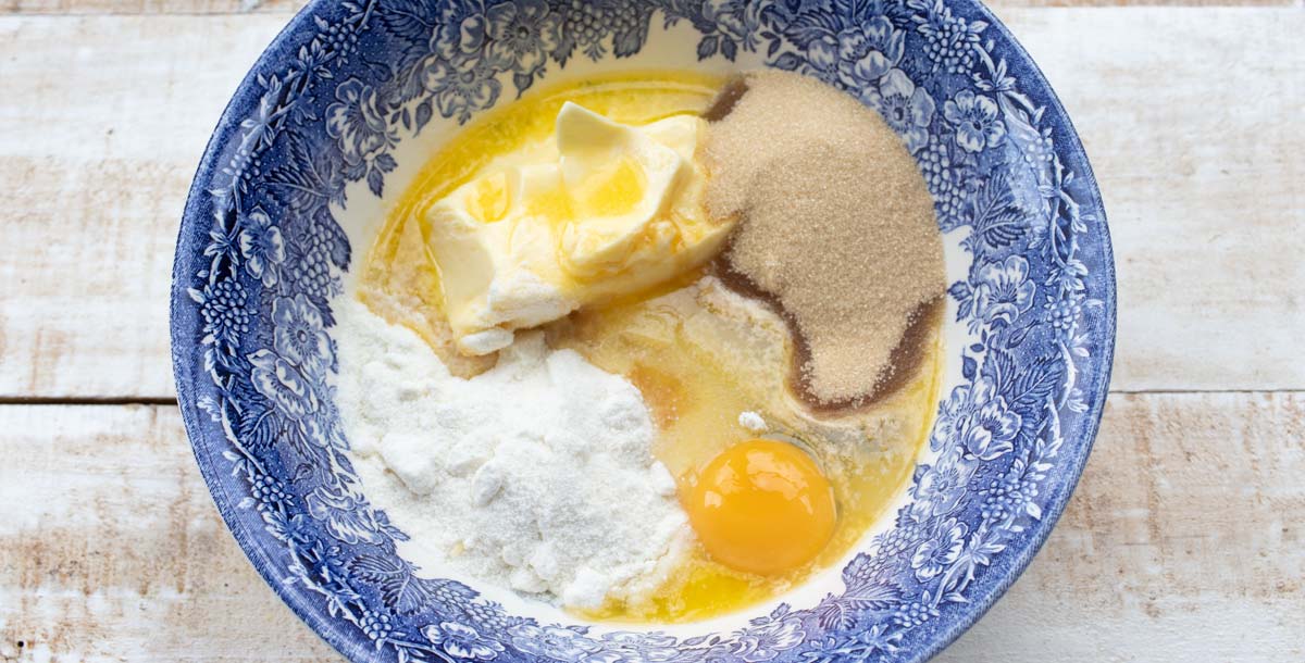 a bowl with butter, flour, egg and sweetener