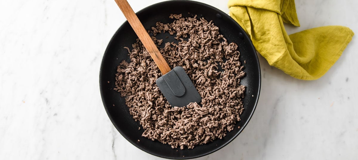 fried ground beef in a frying pan