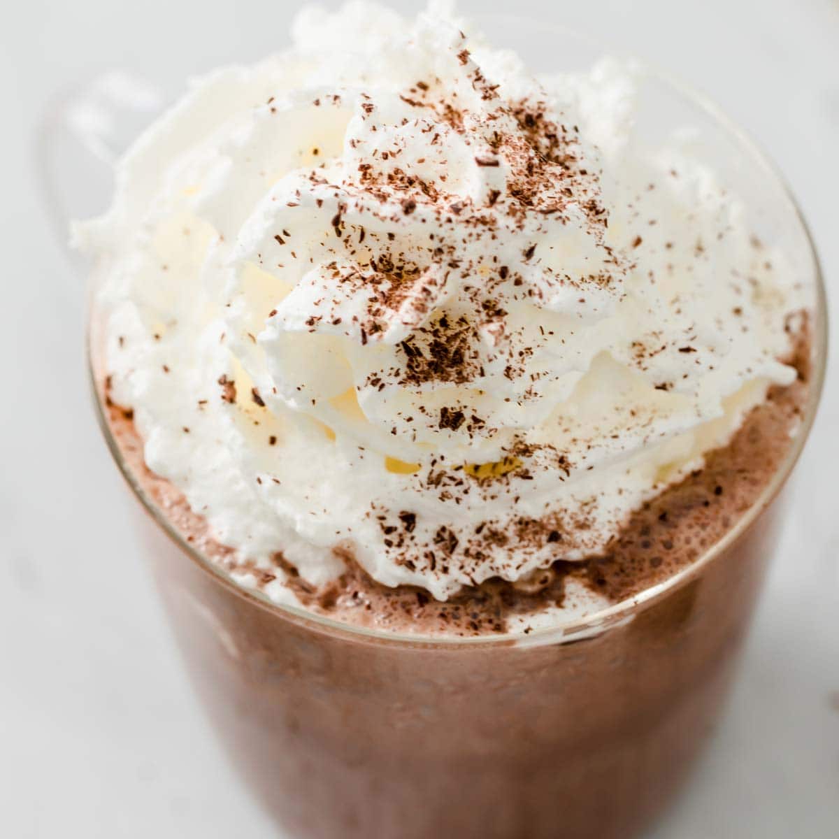 sugar free hot chocolate in a glass topped with whipped cream