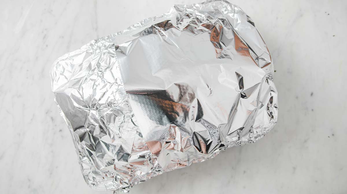 tuket in a roasting pan wrapped in tinfoil