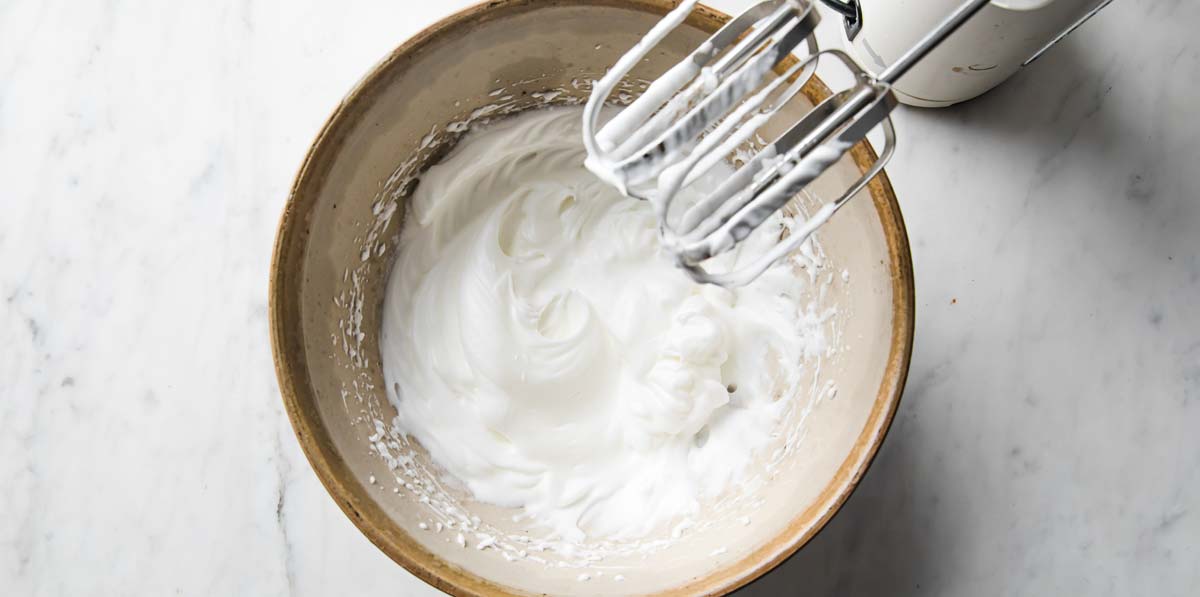 whisking egg whites to stiff peaks with an electric blender
