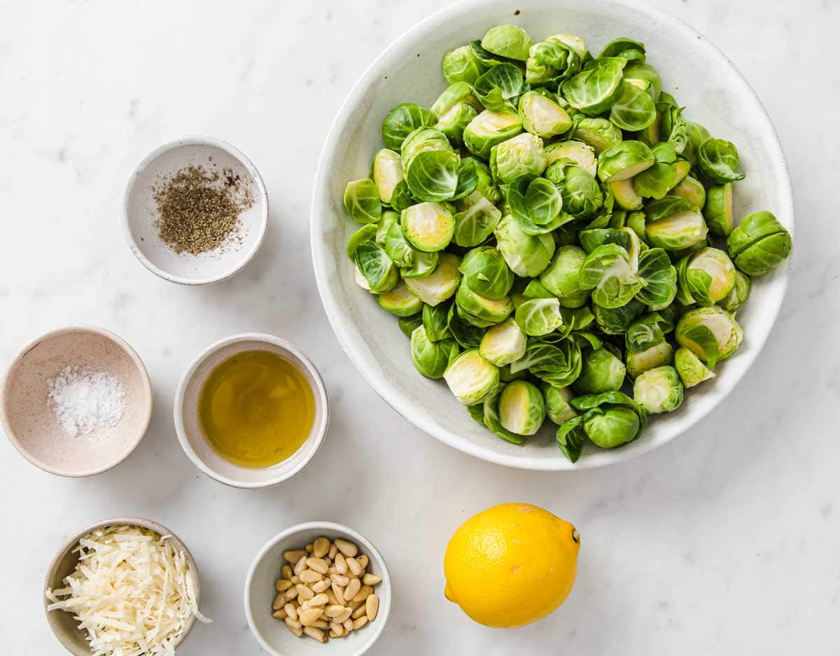 Raw sprouts and other ingredients in bowls.