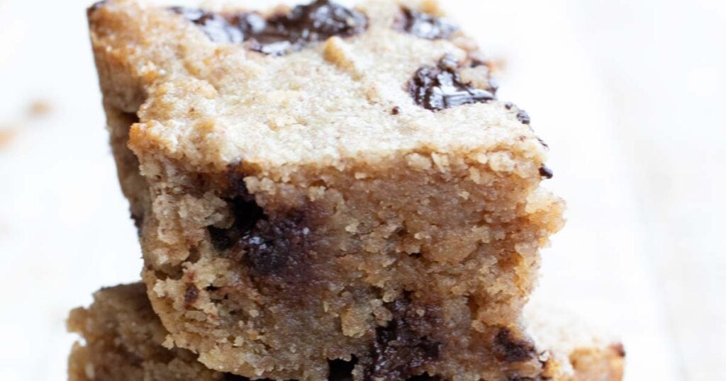 a stack of peanut butter chocolate chip blondies