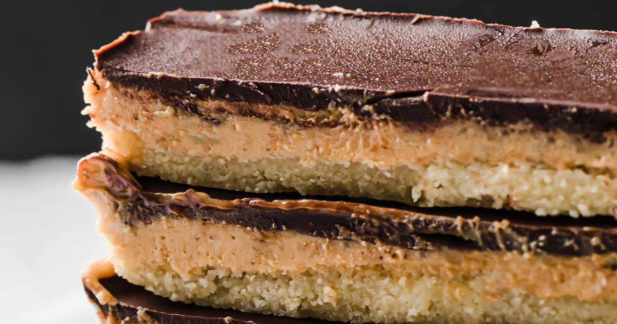 two keto peanut butter chocolate bars stacked on top of each other