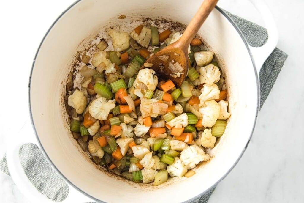 sauteeing vegetables in a large pot