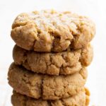 a stack of almond flour peanut butter cookies topped with sea salt
