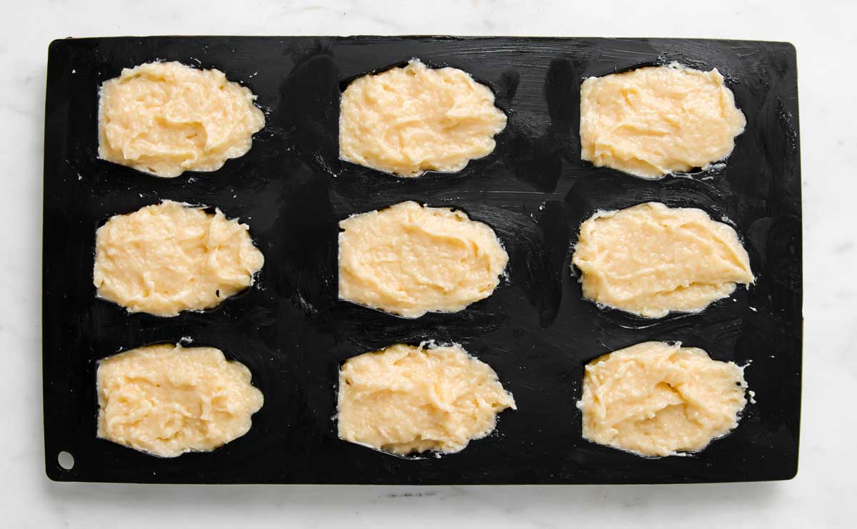 a silicone madeleine mould filled with batter 