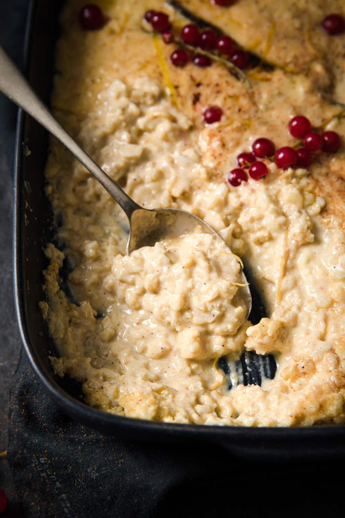 cauliflower rice pudding in a pan with a spoon