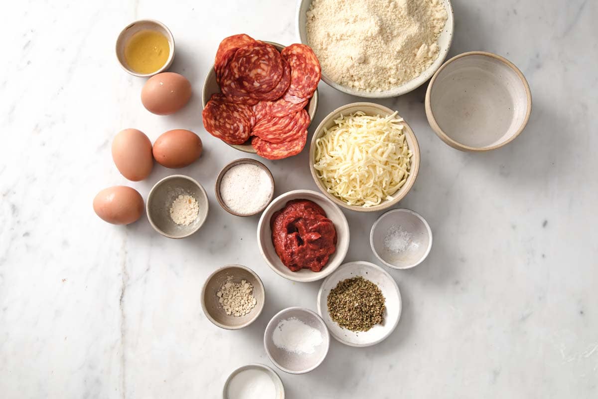 Ingredients for pizza rolls measured into bowls