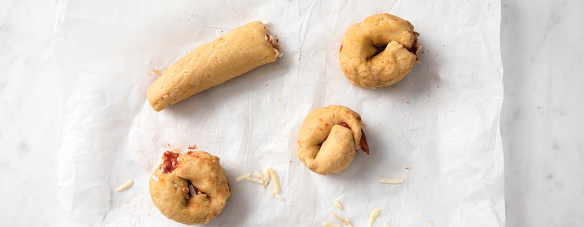 twisting the dough into rolls