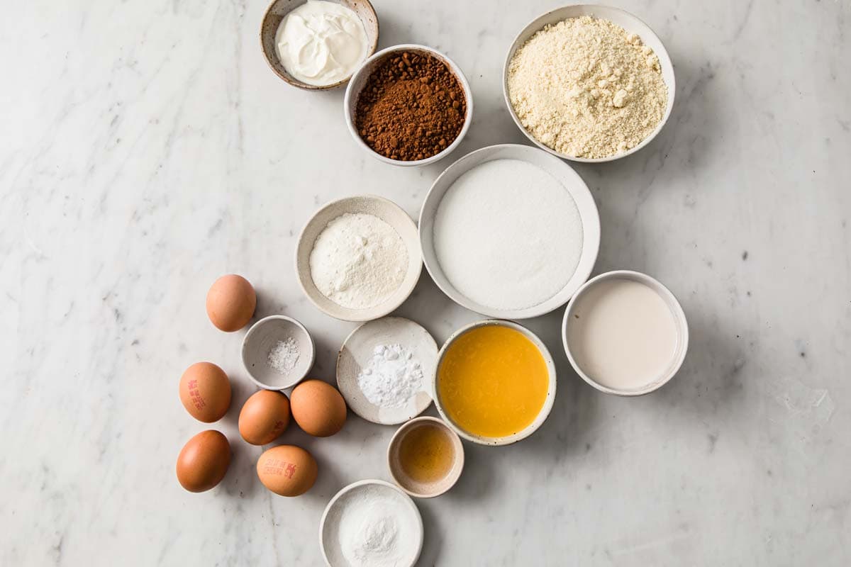 ingredients for low carb chocolate cake measured in bowls